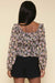 Smocked Long Sleeve Peplum Top